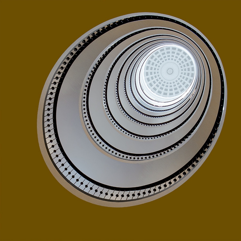 Paul Kilgour oval staircase against yellow