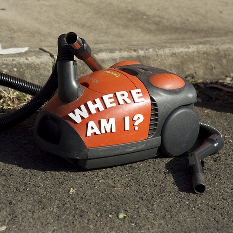 Discarded object with ironic phrase in adhesive letters