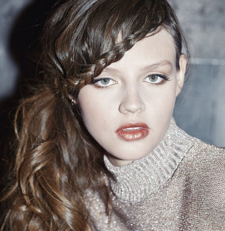 Side-swept braided bangs with loose hair