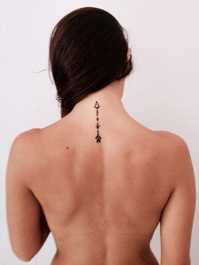 Arrow tattoo on skin reference
