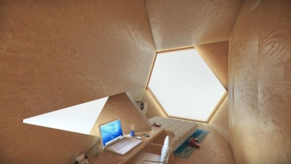 Faceted plywood workspace with laptop and triangular window