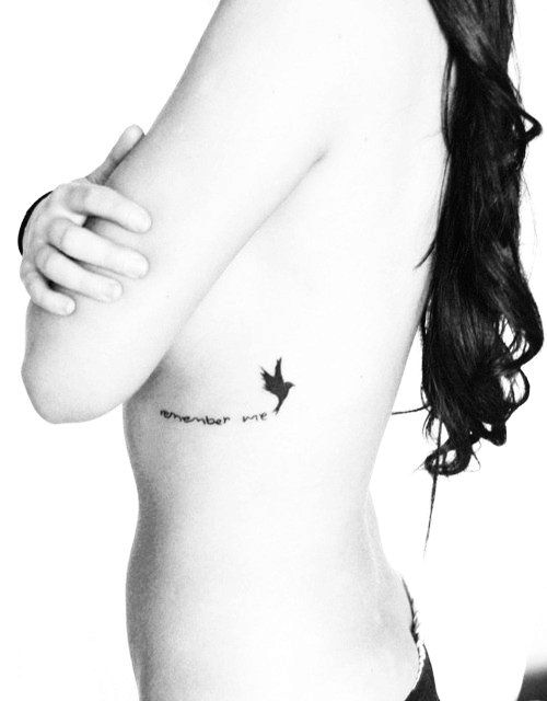 Angel or wing rib tattoo