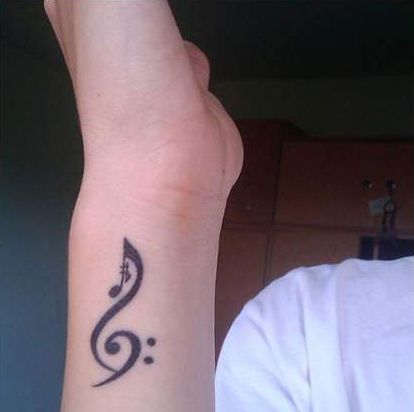 Music note finger tattoo