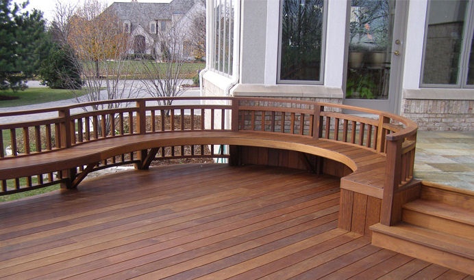 Low outdoor bench along a garden wall
