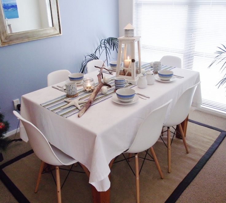 Blue and white tablescape with seashell accents