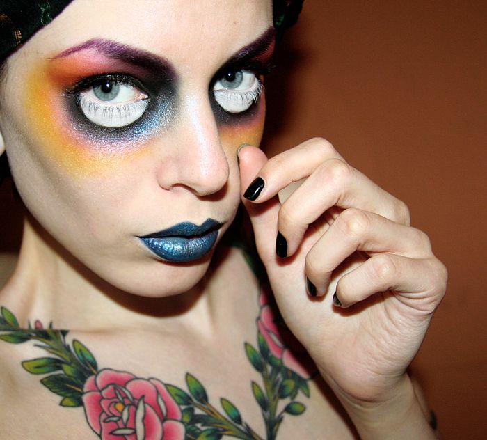 Surreal doll-eye makeup with white lower lashes