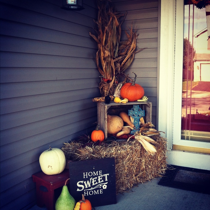 Fall porch with cornstalks and squash