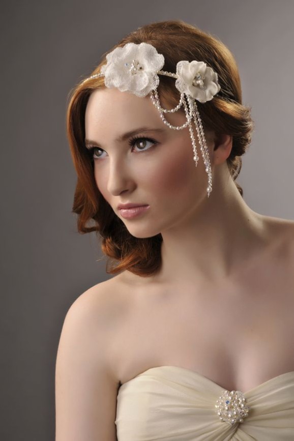 Lace flower headband with pearl and crystal dangles on a bridal updo