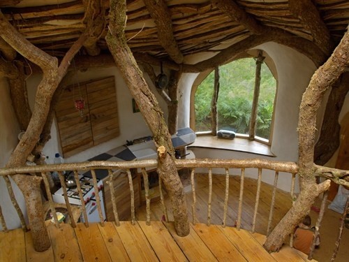 Hobbit-style home in a green landscape
