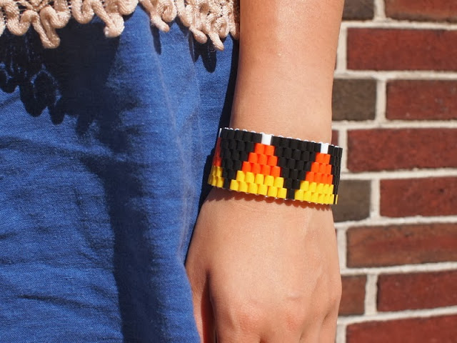 Beaded triangle pendant made with fuse beads