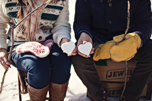 Holiday engagement photo with winter wardrobe
