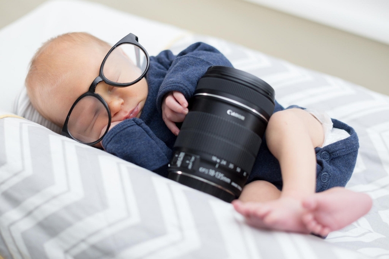 Brad Telker newborn with glasses and camera lens