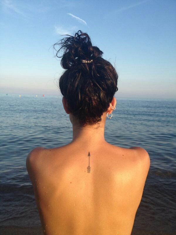 Arrow tattoo with bold linework