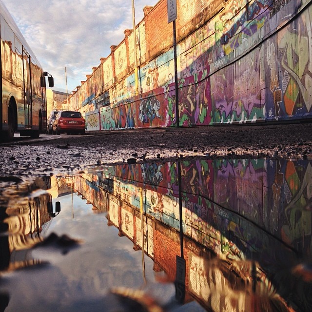 Puddle reflection by Paeders