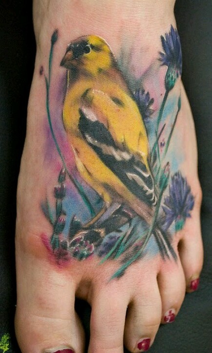 Painterly tattoo with fluid colour