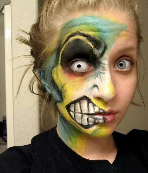 Half-face monster paint with white contact and painted teeth