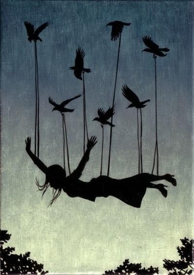 Silhouette figure carried by birds on strings