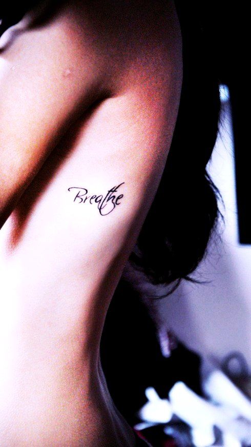 Music note rib tattoo