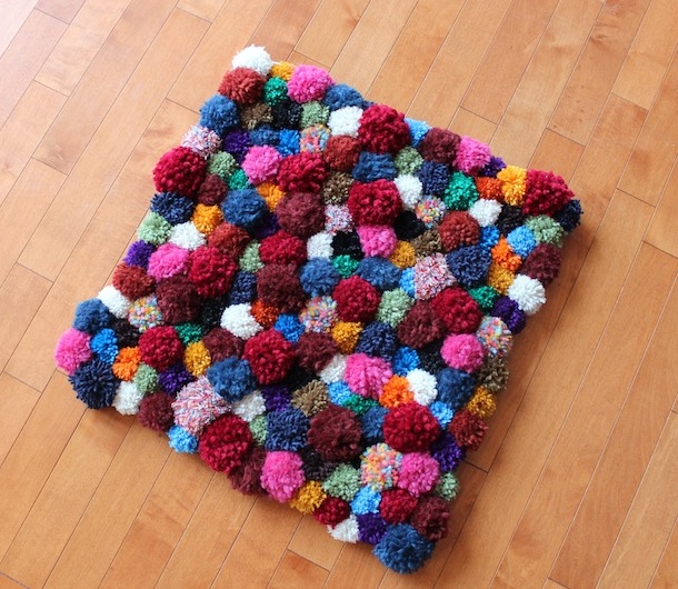 Pom-pom accent DIY rug