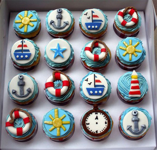 Nautical themed cupcakes with anchors, boats, and lifebuoys