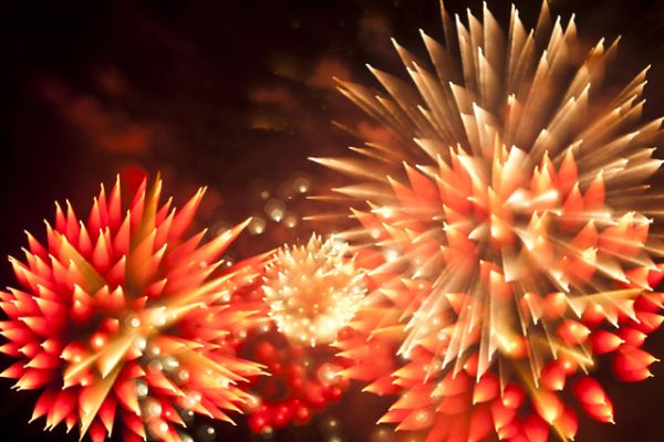 Soft-focus firework burst resolving into sharp tips