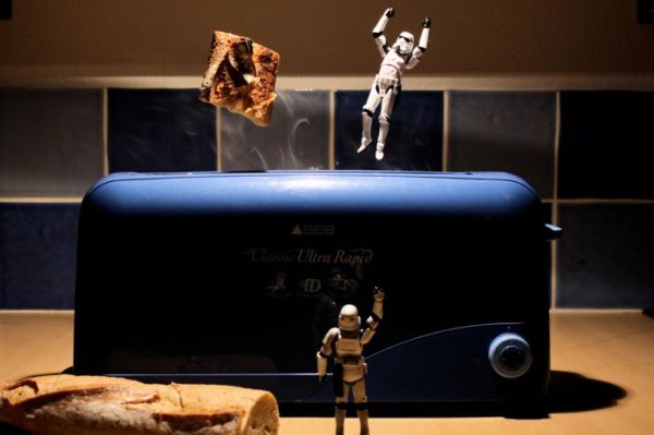 Stormtrooper popping out of a toaster beside flying toast