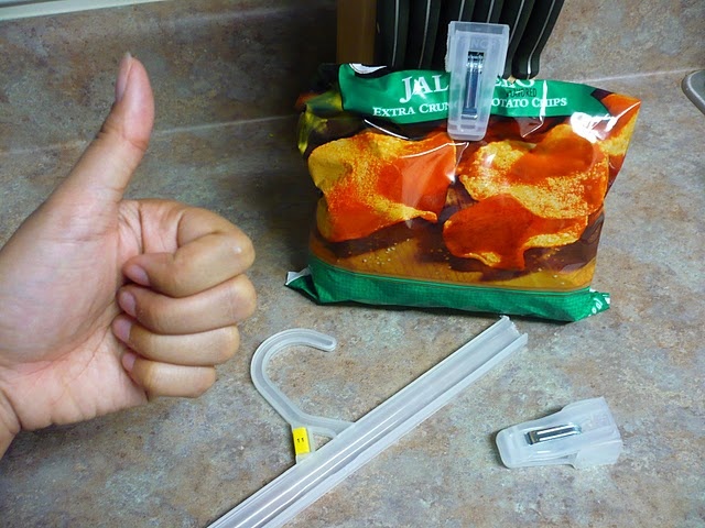 Plastic hanger clips reused to seal a bag of chips