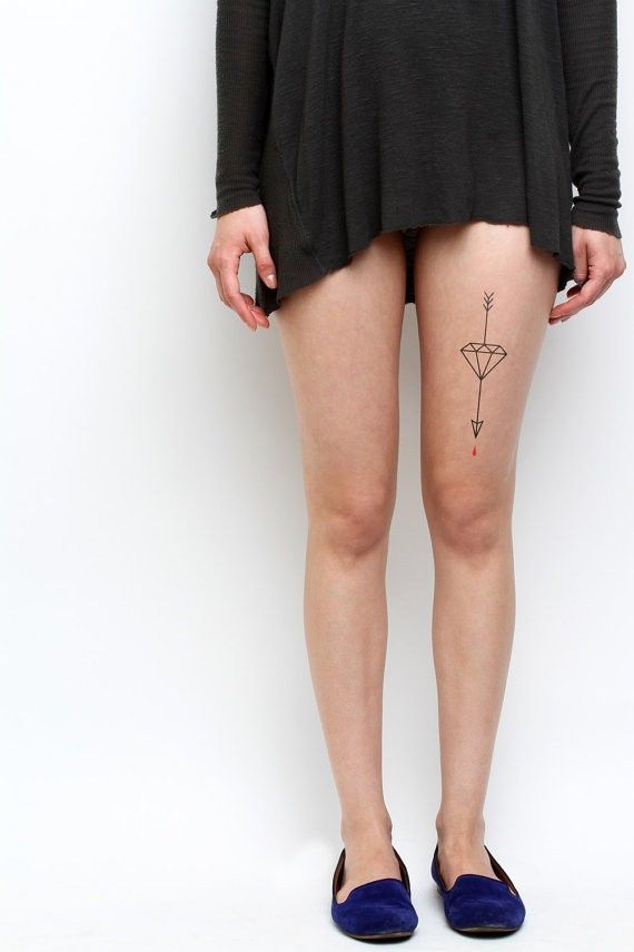 Fine-line arrow tattoo idea