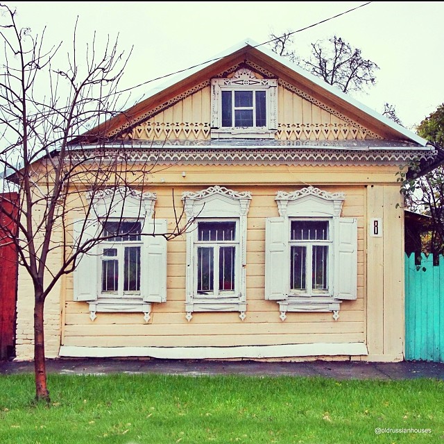 Wooden house with intricate façade carving