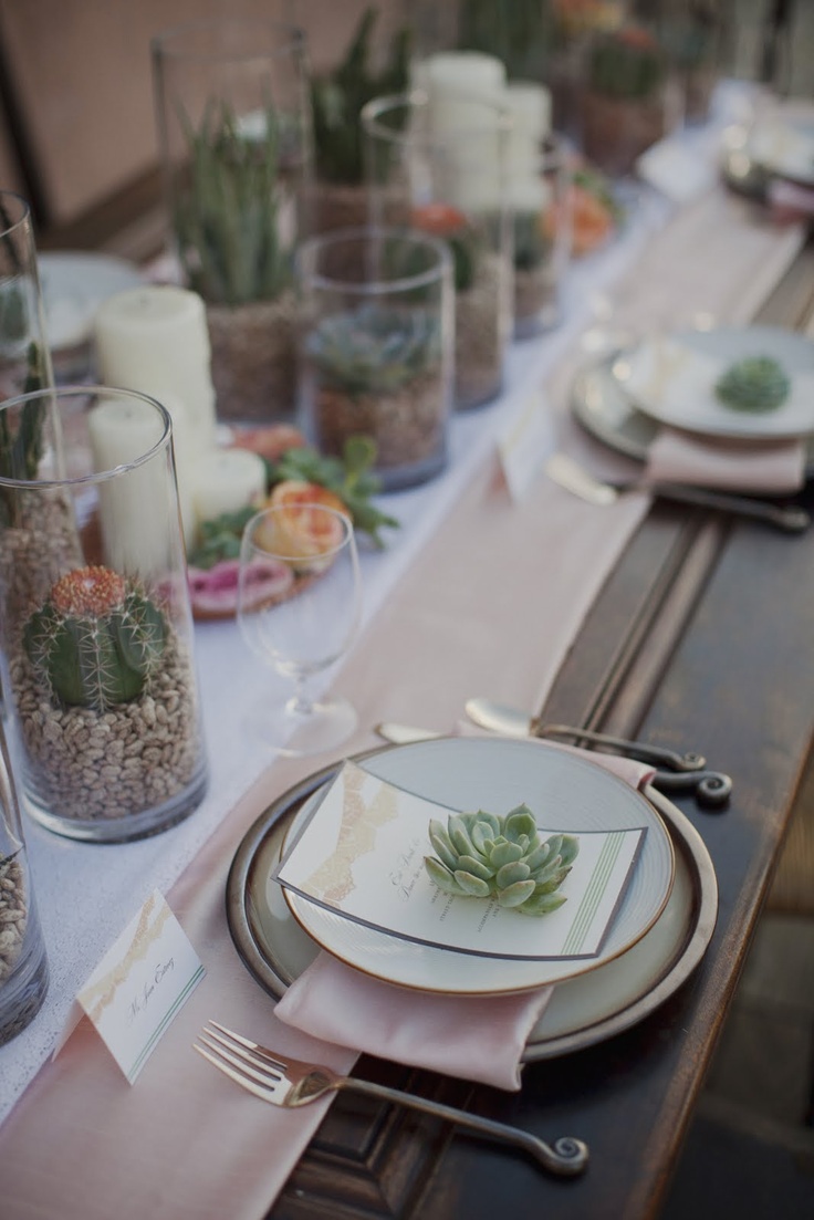 Layered coastal place setting with napkin and shell detail