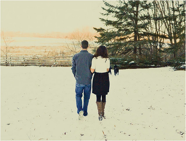 Holiday engagement couple portrait in winter setting