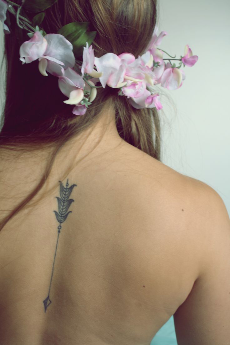 Large arrow tattoo composition
