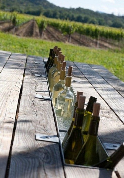 Replace one board of a picnic table with a metal gutter for instant, built-in drink cooler