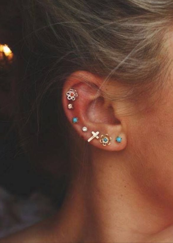 turquoise flower and cross studs along ear rim