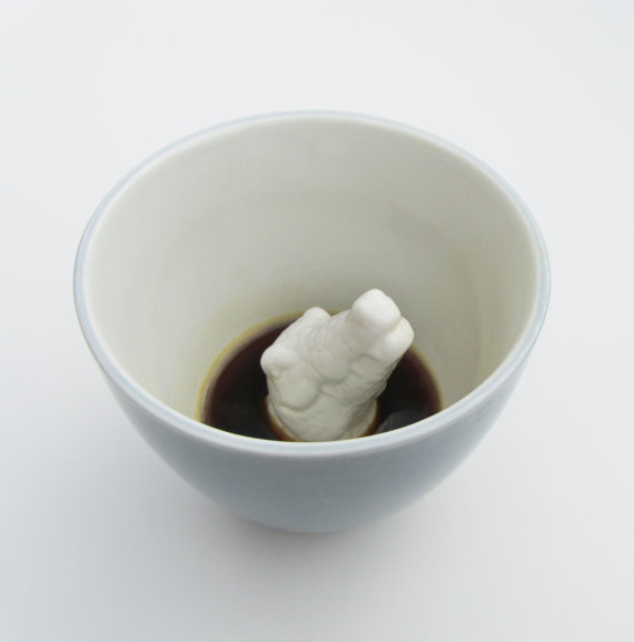 Hidden creature revealed in ceramic mug