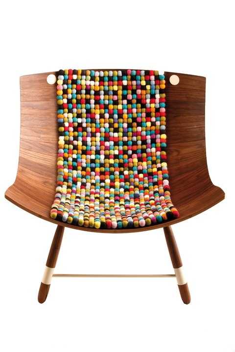 Wooden chair with multicolored felt-ball center strip