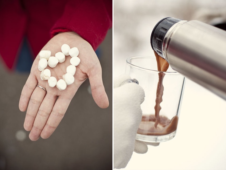 Marshmallow heart in a palm and hot drink poured into a mug