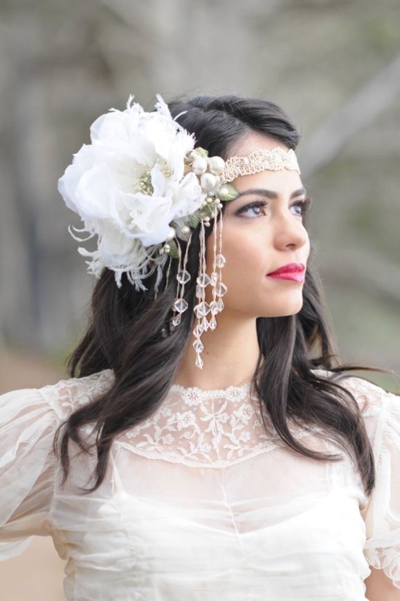 Silk flower feather and crystal cascading headpiece