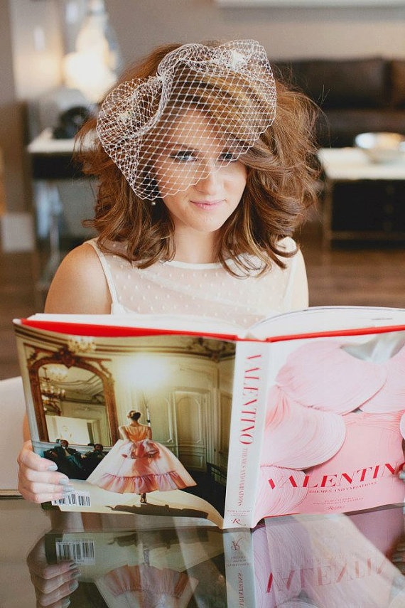 Side view of a birdcage veil hairstyle