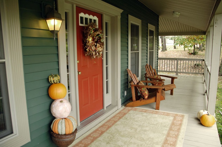 Fall porch with pumpkins and mums