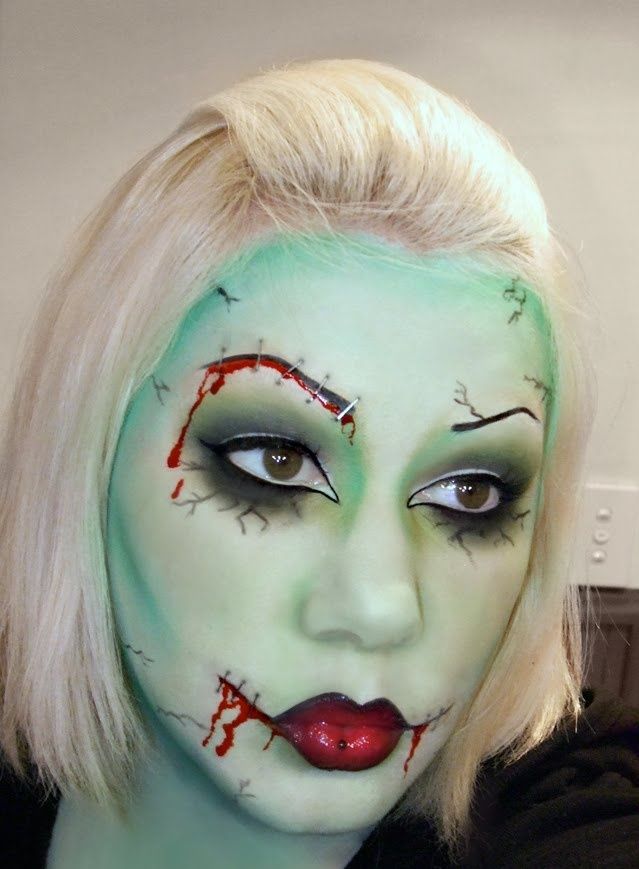 Green glam Frankenstein makeup with staple wounds