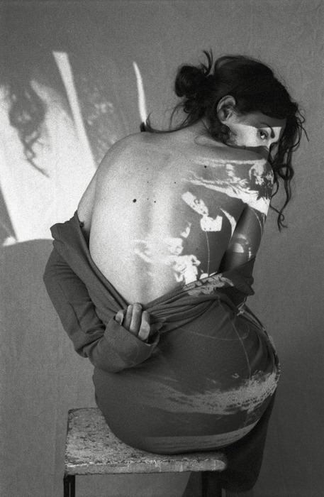 Editorial photograph focusing on the female back